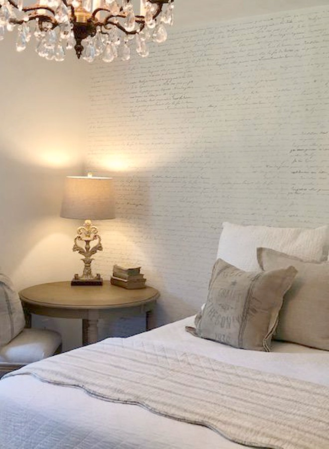 DIY Chic French Script Stenciled Accent Wall. Country French farmhouse style bedroom with French script stenciled wall by Hello Lovely Studio. #frenchcountry #frenchfarmhouse #frenchscript #diy #stenciledwall