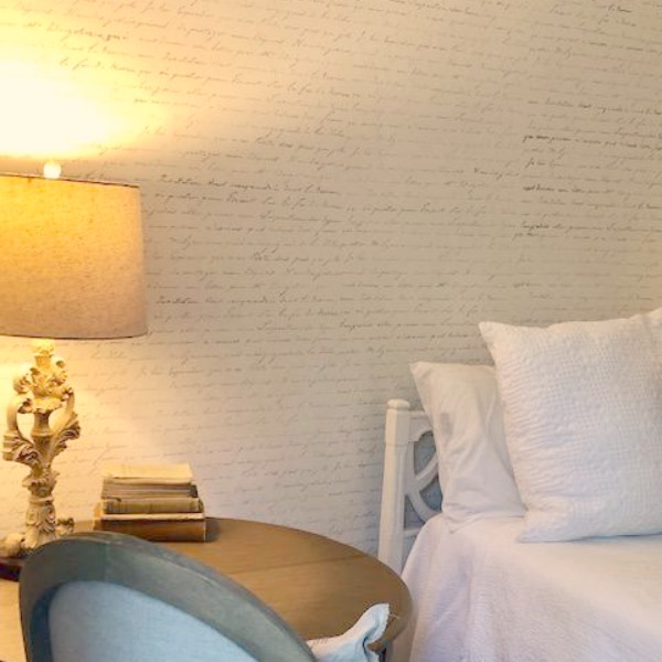 DIY Chic French Script Stenciled Accent Wall. Country French farmhouse style bedroom with French script stenciled wall by Hello Lovely Studio. #frenchcountry #frenchfarmhouse #frenchscript #diy #stenciledwall