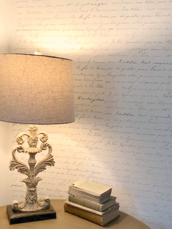 DIY Chic French Script Stenciled Accent Wall. Country French farmhouse style bedroom with French script stenciled wall by Hello Lovely Studio. #frenchcountry #frenchfarmhouse #frenchscript #diy #stenciledwall