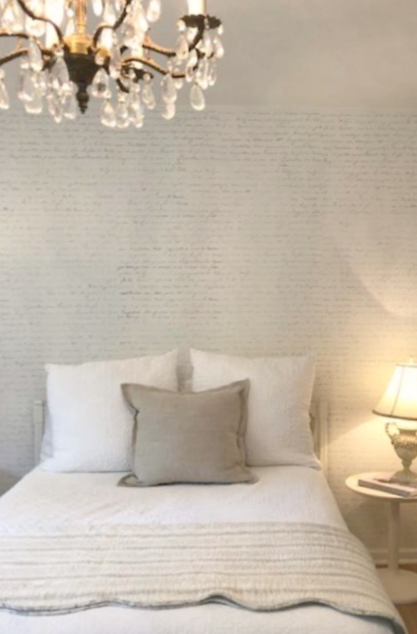 DIY Chic French Script Stenciled Accent Wall. Country French farmhouse style bedroom with French script stenciled wall by Hello Lovely Studio. #frenchcountry #frenchfarmhouse #frenchscript #diy #stenciledwall