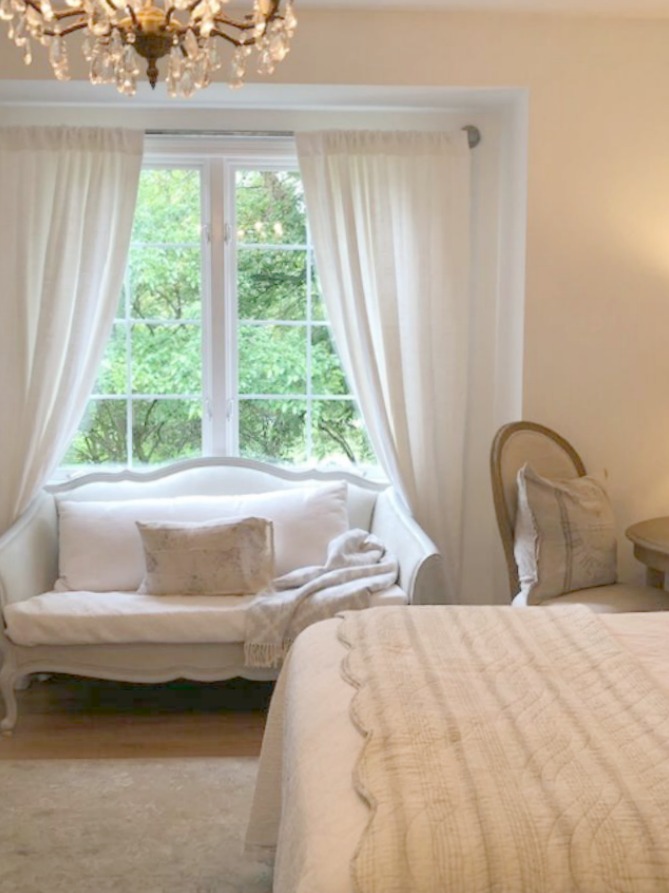 DIY Chic French Script Stenciled Accent Wall. Country French farmhouse style bedroom with French script stenciled wall by Hello Lovely Studio. #frenchcountry #frenchfarmhouse #frenchscript #diy #stenciledwall