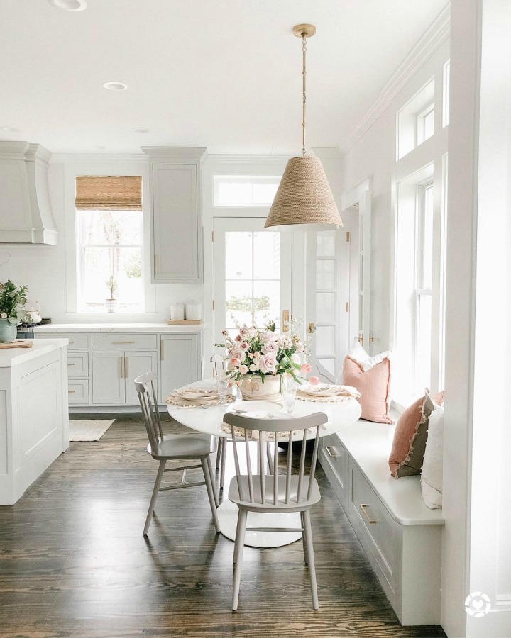 Elegant white farmhouse kitchen with Benjamin Moore Repose Grey cabinets, subway tile, gold accents, and reclaimed barn wood. Design: Finding Lovely. Wall color: Benjamin Moore Chantilly Lace.