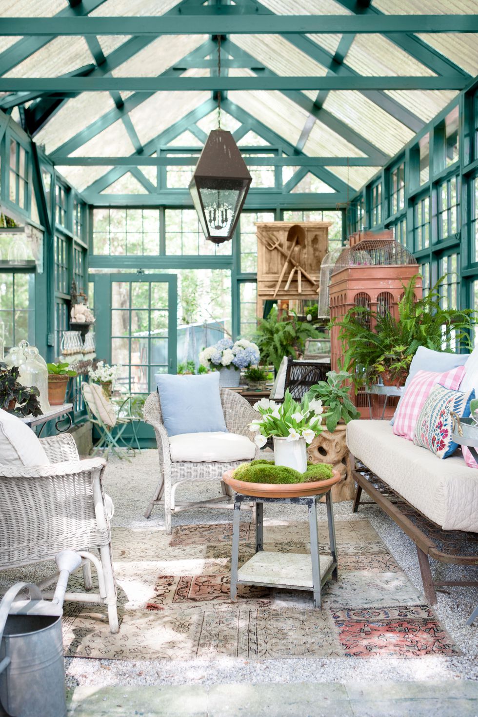 Chic she shed garden retreat with luxurious interior in backyard by Susanne Hudson. Green trim is painted Benjamin Moore Tarrytown Green.