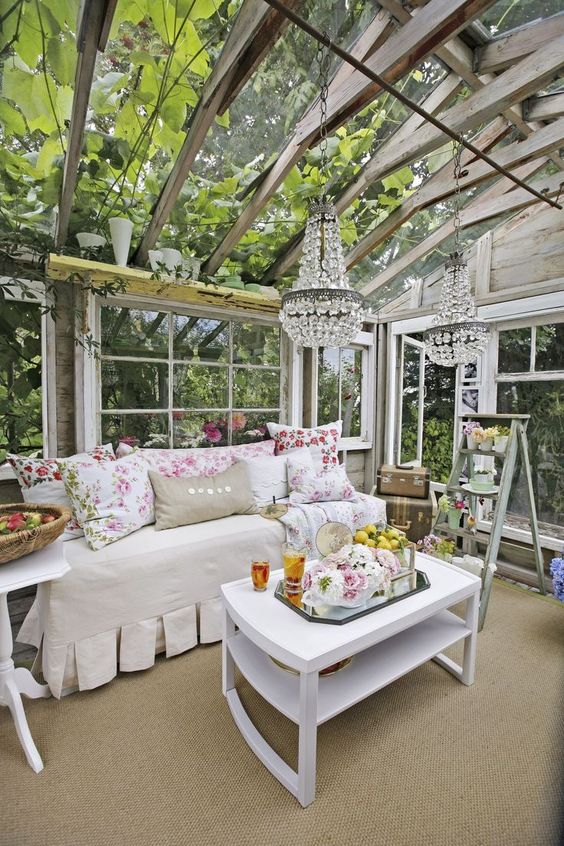 Glamorous backyard chic she shed greenhouse with darling furniture and crystal chandelier. #sheshed #greenhouse #backyardoasis #shabbychic #sheds