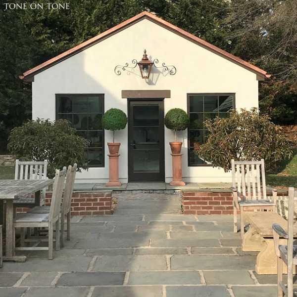 Stunning exterior of a beautiful potting shed in the backyard of a magnificent Tudor property - Tone on Tone. Come explore She Shed Chic, Potting Shed & Backyard Inspiration.