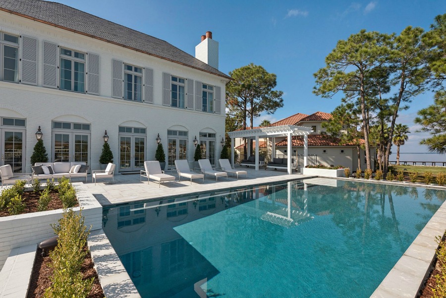 Luxurious pool design inspiration from a magnificent coastal style classic home by architect Geoff Chick. #coastalstyle #pooldesign