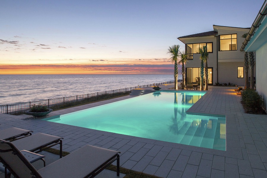 Luxurious pool design inspiration from a magnificent coastal style classic home by architect Geoff Chick. #beachhouse #coastalstyle #pooldesign #luxurypool