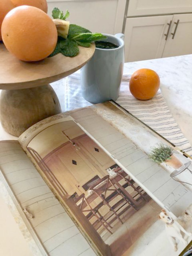 Ingredients for fresh mint tea in my white kitchen - Hello Lovely Studio. Visit the story with praise for the book La Vie Est Belle as well as Charming French Inspired Finds!