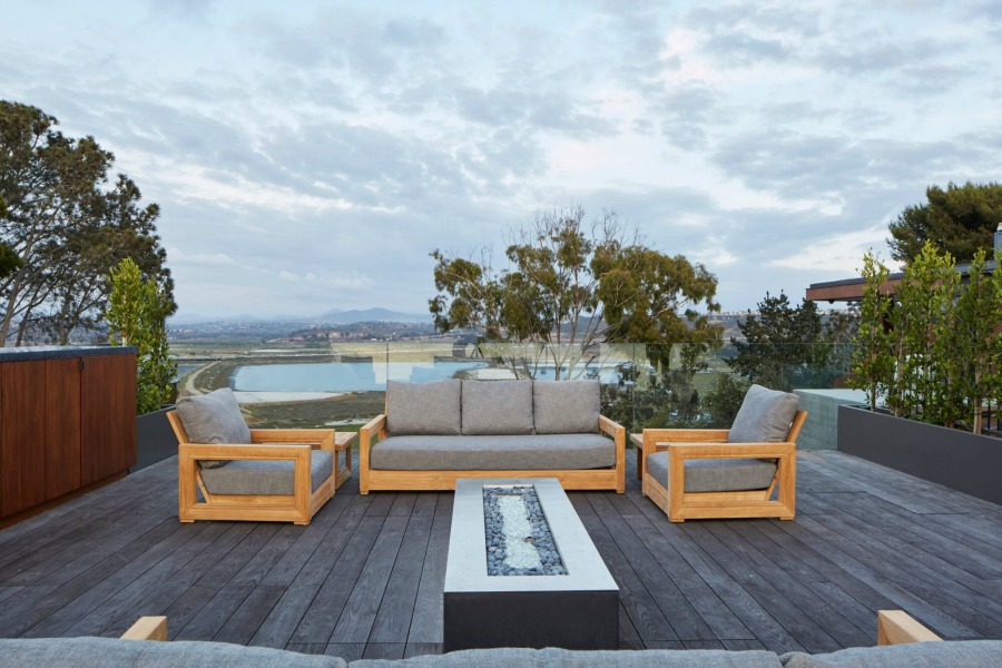 Beautifully designed deck patio with firepit and design by KAA.