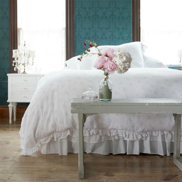 Teal walls in a shabby chic style bedroom designed by Rachel Ashwell.