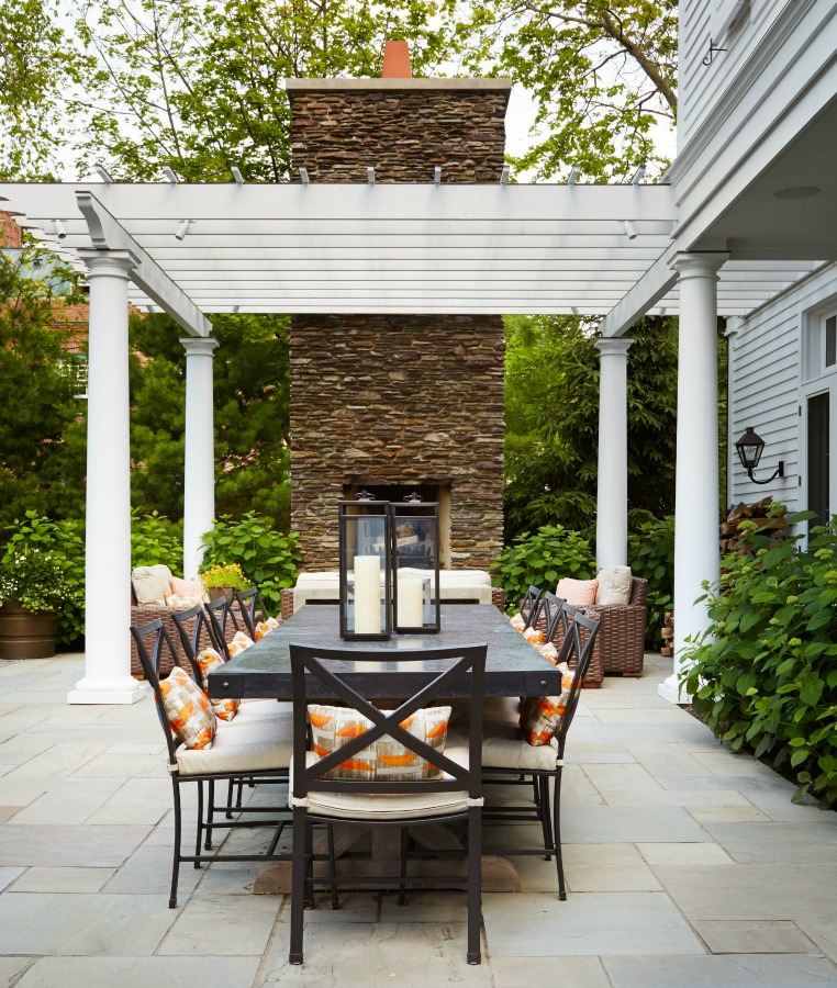 Magnificent pergola with outdoor dining and design by Tom Stringer on Hello Lovely Studio.