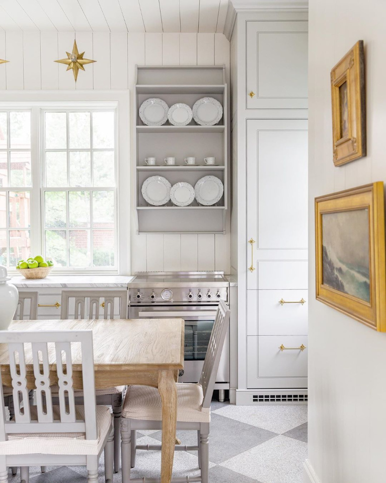 Traditional and elegant white farmhouse kitchen with grey and brass accents - The Fox Group. #timelesskitchens