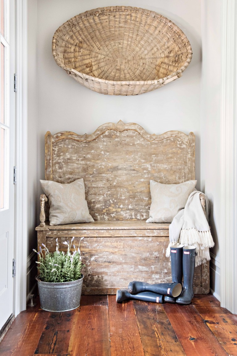 Rustic French farmhouse style in an entry with a weathered bench, boots, bucket, and basket! Kelli Boyd Photography. #frenchfarmhouse #weatheredbench #interiordesign #rusticmodern #modernfrench