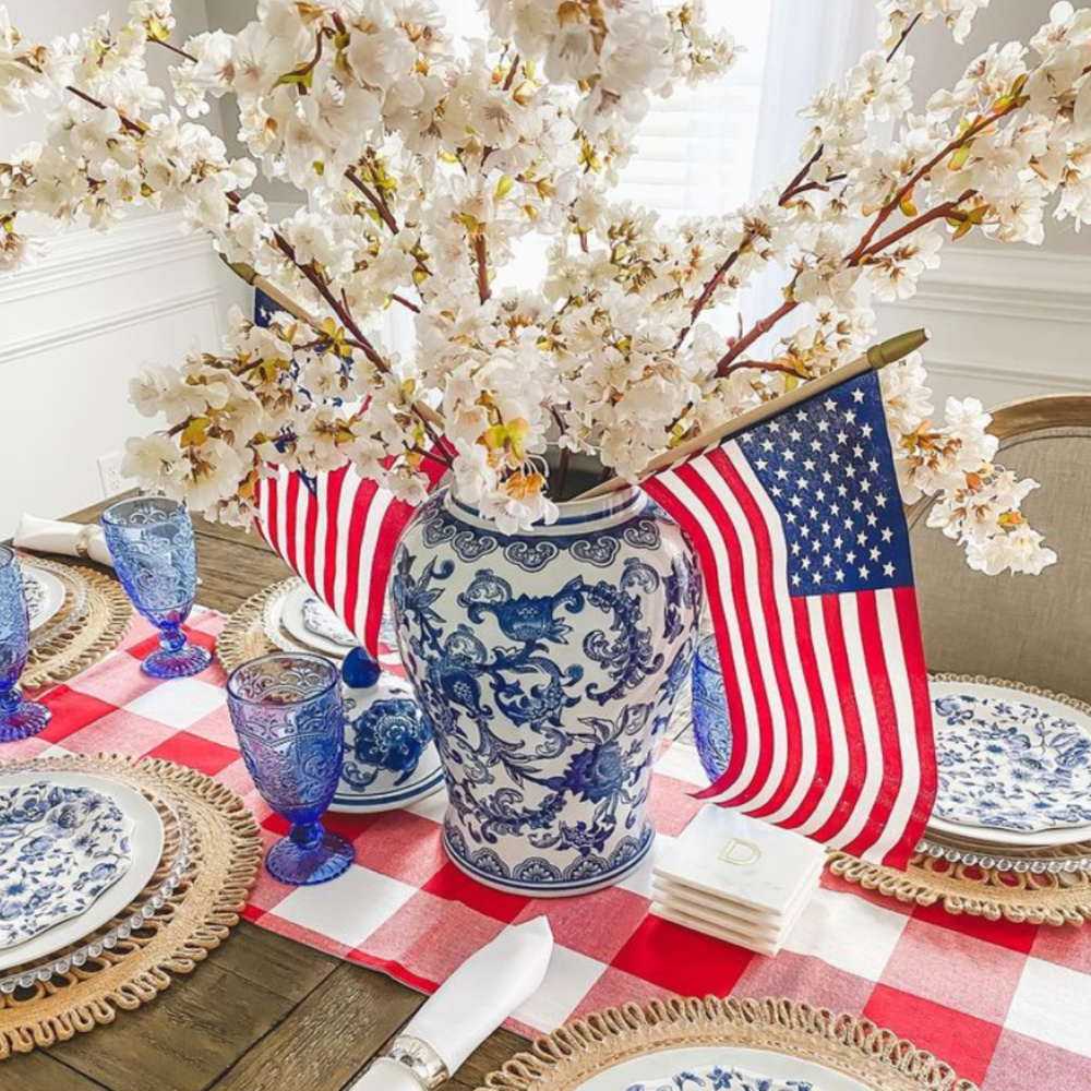 Beautiful 4th of July tablescape with gingham runner and red, white, and blue - @autumnraedavis.