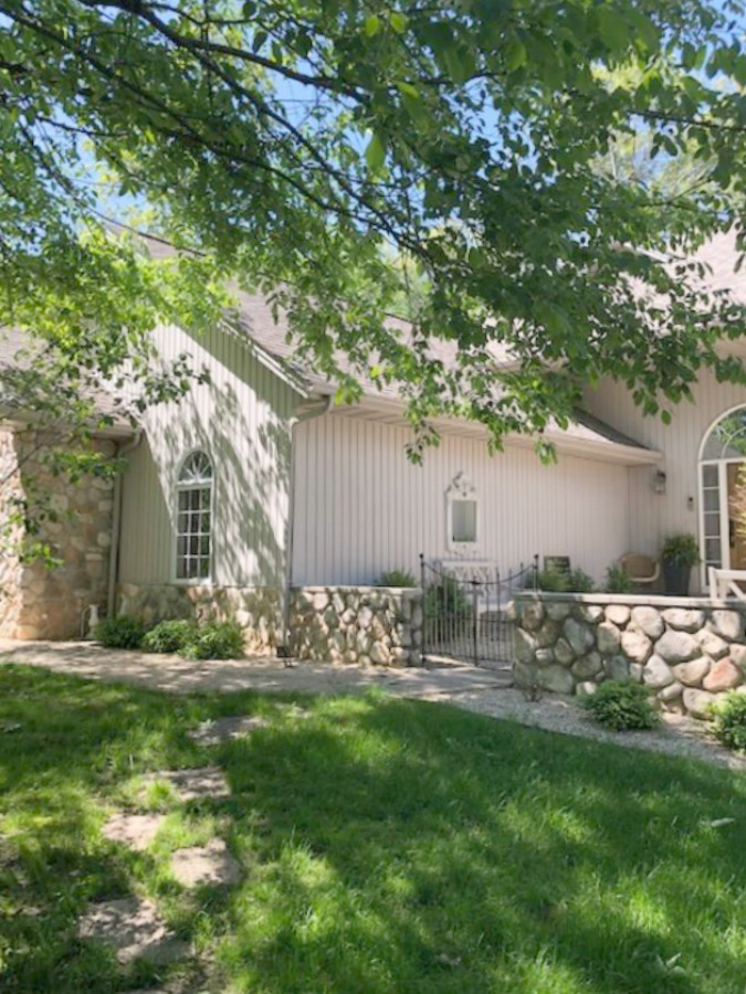 Exterior of our woodsy Nordic French style cottage - Hello Lovely Studio.