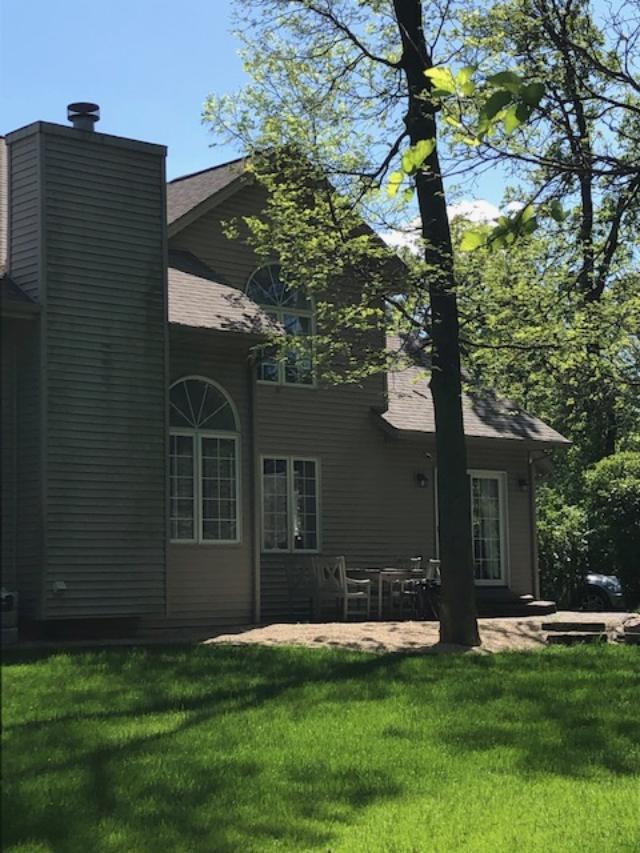 Back exterior of our woodsy cottage - Hello Lovely Studio.