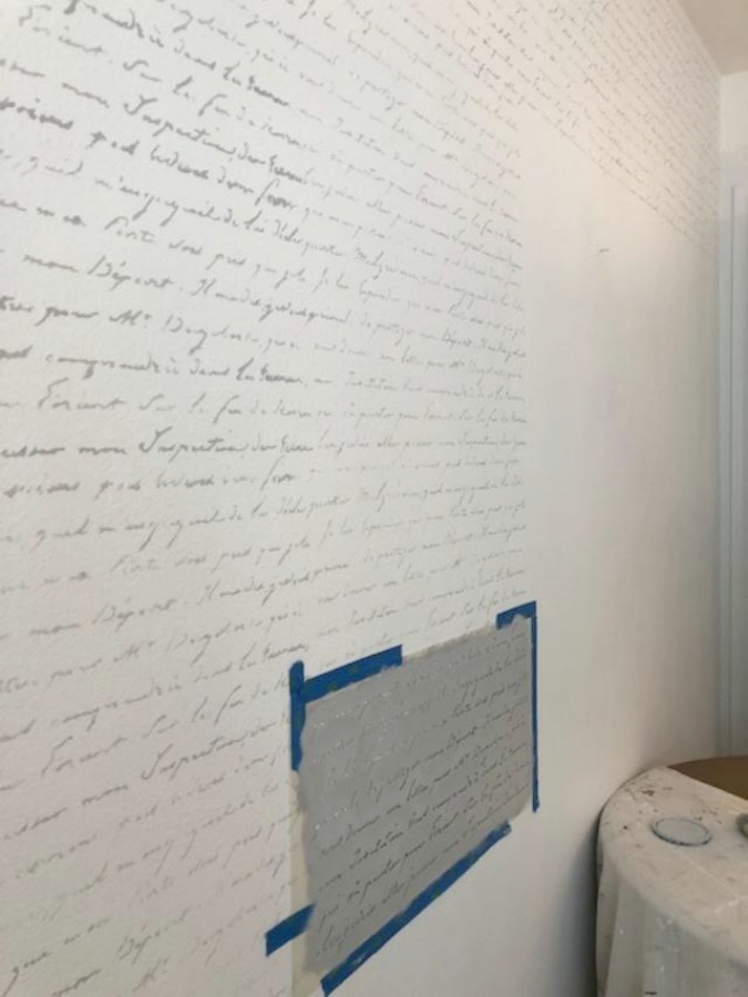 DIY Chic French Script Stenciled Accent Wall. French script stencil statement wall - Hello Lovely Studio.