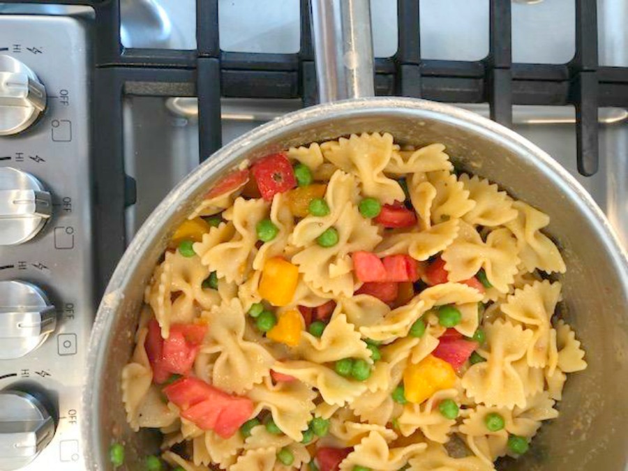 Summer pasta salad with fresh tomatoes and peas - Hello Lovely Studio.
