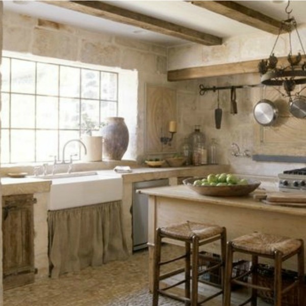 Chateau Domingue. Proprietor Ruth Gay’s Tuscan country manor style kitchen is a revelation…certainly rustic and refined indeed! Linen softens the apron front sink and walls created with French Limestone Bugets as well as reclaimed cobblestone flooring.