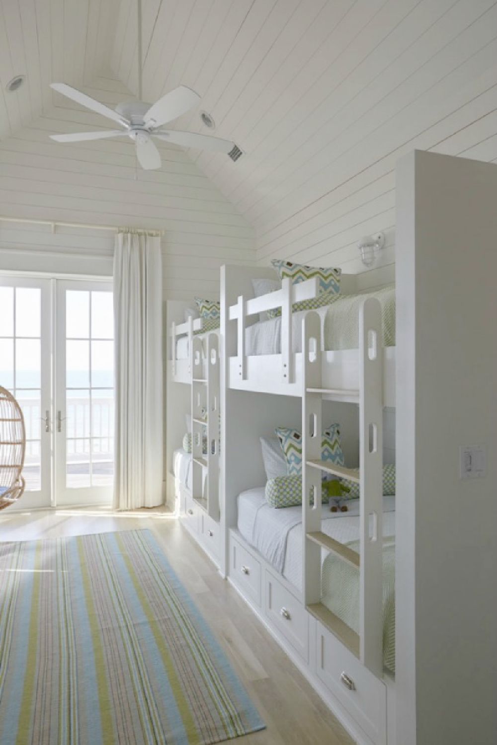 Bunk room with coastal style, built-ins, and shiplap walls and ceilings - Geoff Chick. #bunkrooms #coastalstyle #builtinbunks