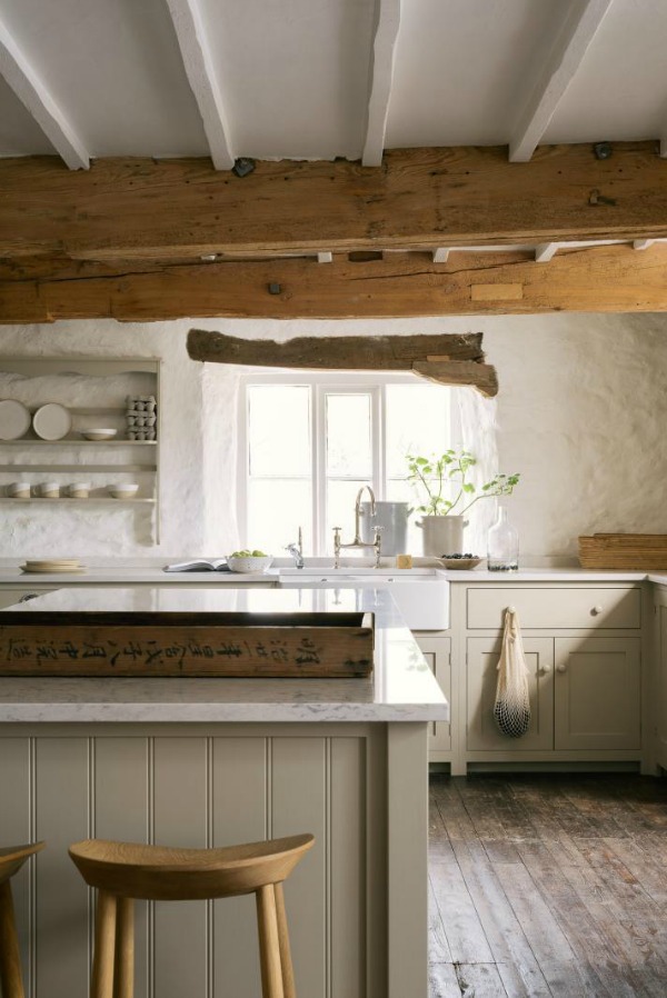 Beautifully rustic English country kitchen in the UK by deVOL has Shaker style cabinetry, farm sink, and a serene palette. #englishcountry #countrykitchen #kitchendesign #rustickitchen #frenchkitchen #shakerkitchen