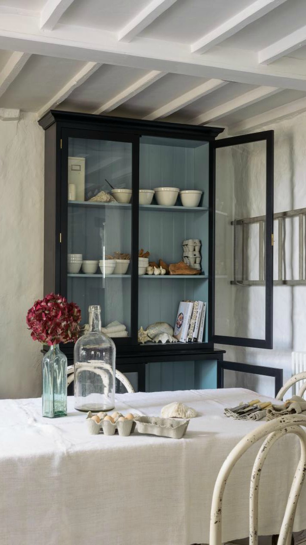 Beautifully rustic English country kitchen in the UK by deVOL has Shaker style cabinetry, farm sink, and a serene palette. #englishcountry #countrykitchen #kitchendesign #rustickitchen #frenchkitchen #shakerkitchen