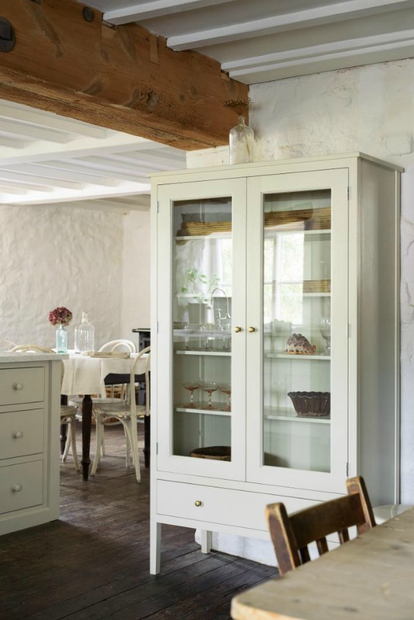 Beautifully rustic English country kitchen in the UK by deVOL has Shaker style cabinetry, farm sink, and a serene palette. #englishcountry #countrykitchen #kitchendesign #rustickitchen #frenchkitchen #shakerkitchen