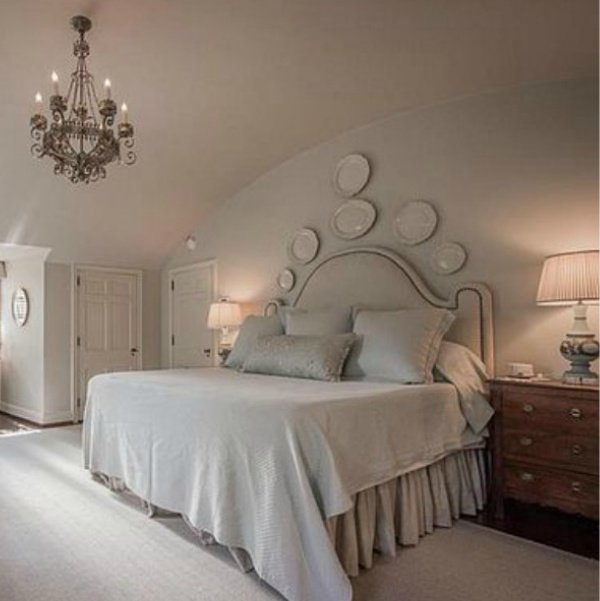 Romantic French bedroom with plates on wall in an elegant historic home with Old World style and beautifully classic European inspired interiors in Marietta Georgia was built for the Kennedy-DuPre family. . See more  English Tudor Interior Design Inspiration from this European Country Master Suite & Dining Room Design Inspiration on Hello Lovely Studio.