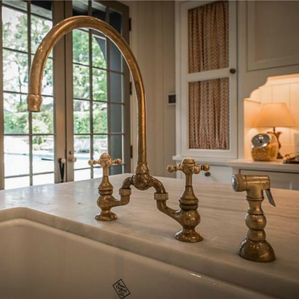 Detail of brass bridge faucet in kitchen of an elegant historic home with Old World style and beautifully classic European inspired interiors in Marietta Georgia was built for the Kennedy-DuPre family. See more in Traditional Style House Tour: 1935 English Tudor on Hello Lovely Studio.