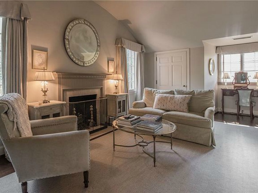 Sitting room in bedroom with fireplace in an elegant historic home with Old World style and beautifully classic European inspired interiors in Marietta Georgia was built for the Kennedy-DuPre family.. See more  English Tudor Interior Design Inspiration from this European Country Master Suite & Dining Room Design Inspiration on Hello Lovely Studio.