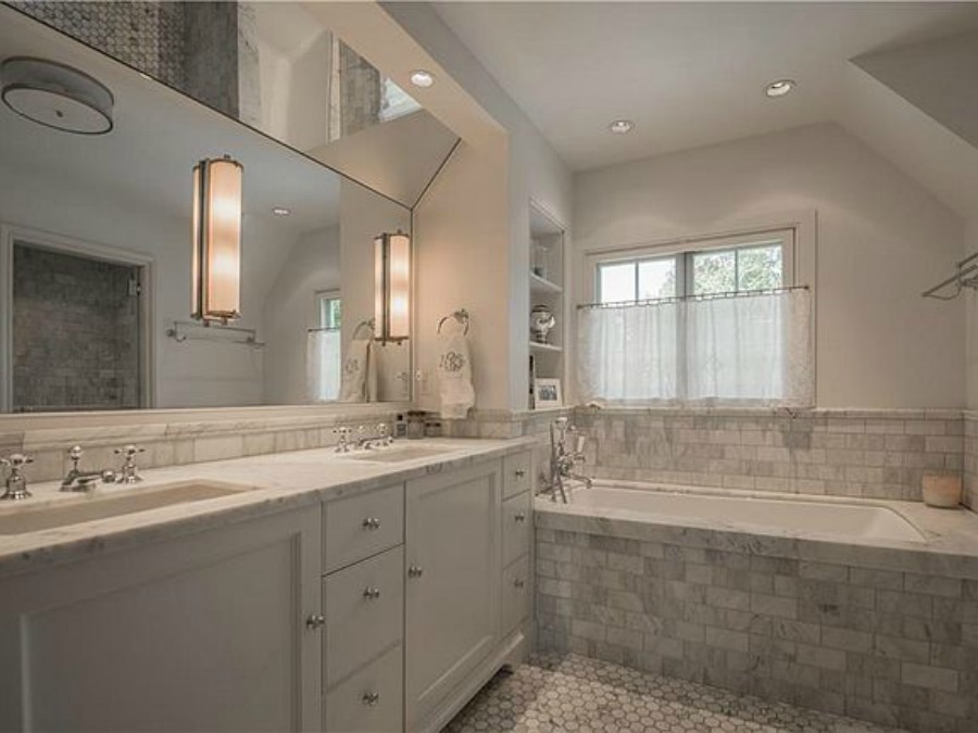 Luxurious marble bathroom in an elegant historic home with Old World style and beautifully classic European inspired interiors in Marietta Georgia was built for the Kennedy-DuPre family.. See more  English Tudor Interior Design Inspiration from this European Country Master Suite & Dining Room Design Inspiration on Hello Lovely Studio.