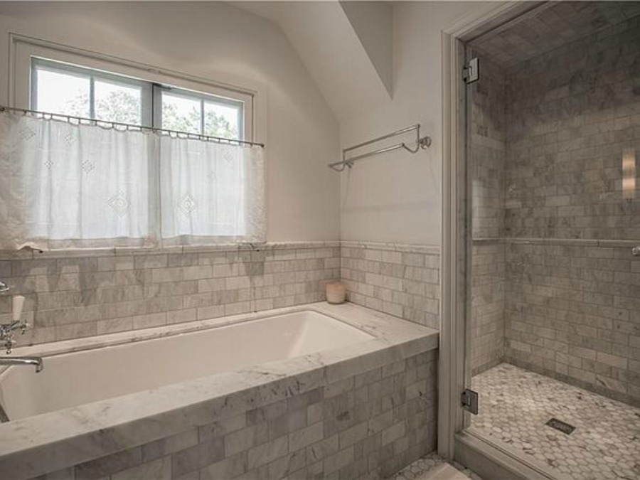 Luxurious marble bathroom in an elegant historic home with Old World style and beautifully classic European inspired interiors in Marietta Georgia was built for the Kennedy-DuPre family. . See more  English Tudor Interior Design Inspiration from this European Country Master Suite & Dining Room Design Inspiration on Hello Lovely Studio.