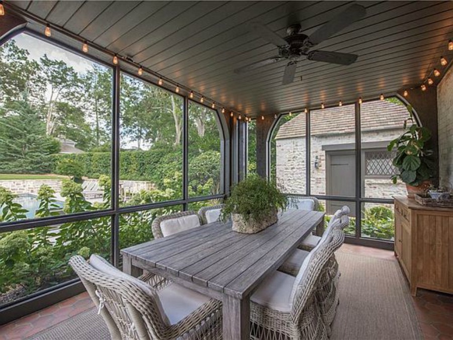 Screen porch at an elegant historic home with Old World style and beautifully classic European inspired interiors in Marietta Georgia was built for the Kennedy-DuPre family. See more in Traditional Style House Tour: 1935 English Tudor on Hello Lovely Studio.