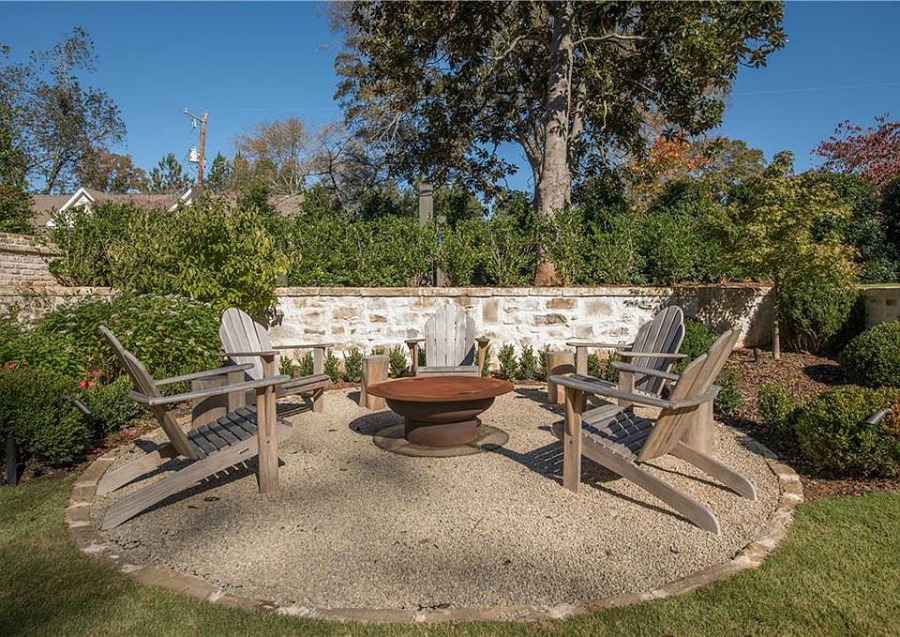 Fire pit area at an elegant historic home with Old World style and beautifully classic European inspired interiors in Marietta Georgia was built for the Kennedy-DuPre family. 