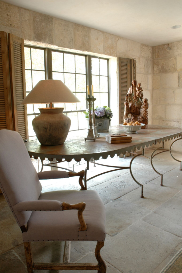 Romantic console table. Chateau Domingue antiques and reclaimed stone in a breathtaking Houston home with interior design by Pamela Pierce. #chateaudomingue #frenchfarmhouse #interiordesign #oldworld #pamelapierce #reclaimedstone