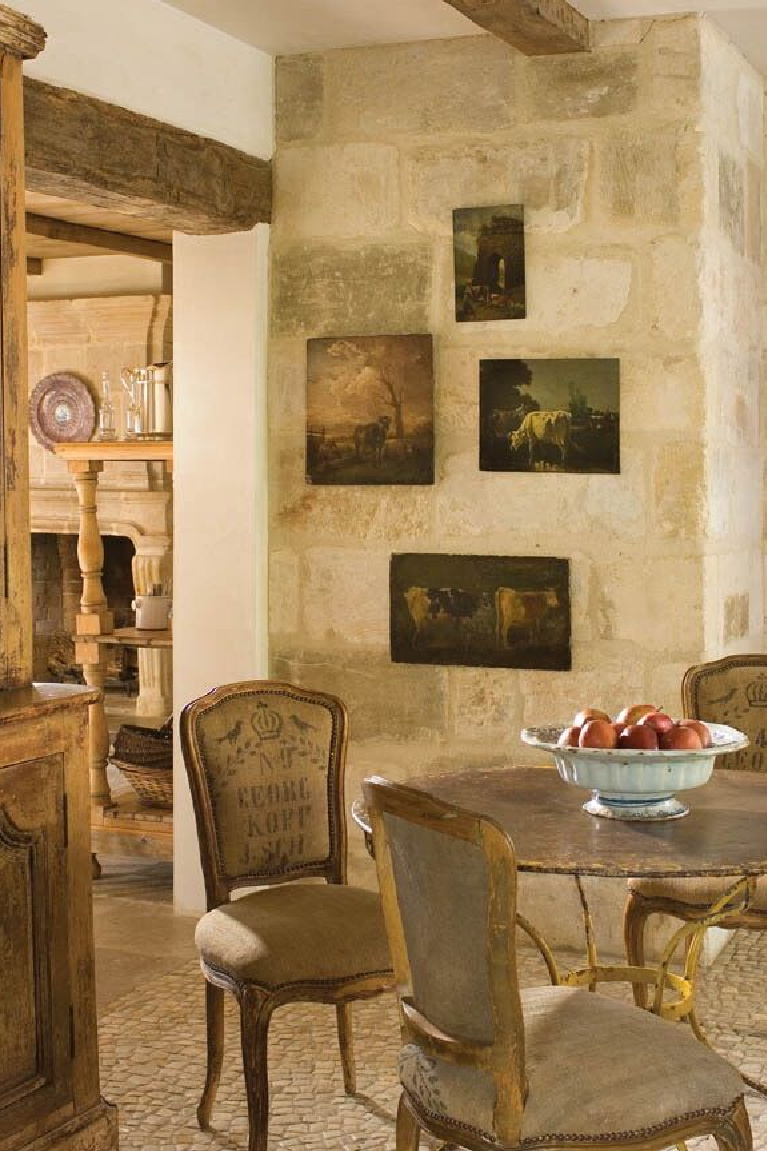 Breakfast dining. Exquisite reclaimed stone and architectural elements from Europe mix with antiques in a breathtaking room at founder of Chateau Domingue, Ruth Gay's home. #frenchfarmhouse #europeancountry #antiques #chateaudomingue