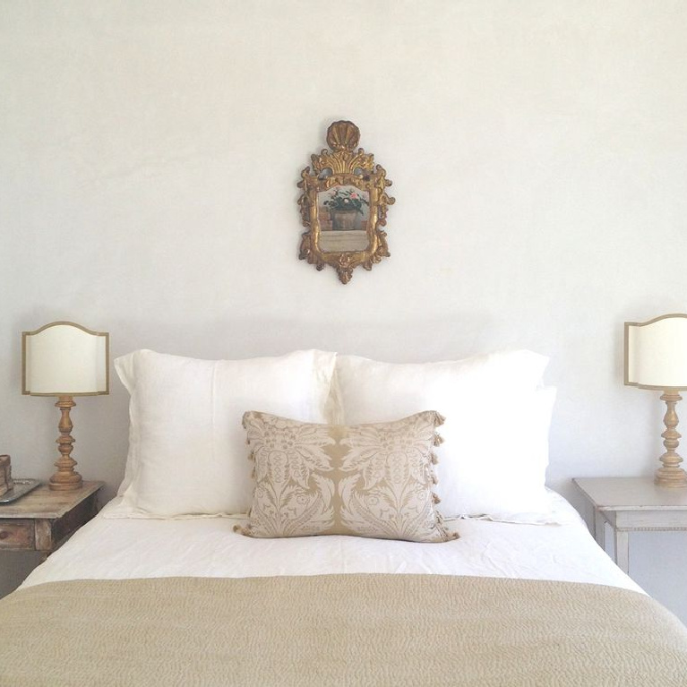 Serene white European country French farmhouse bedroom designed by Brooke Giannetti for Patina Farm. #bedroomdecor #interiordesign #serenedecor #frenchfarmhouse #europeancountry
