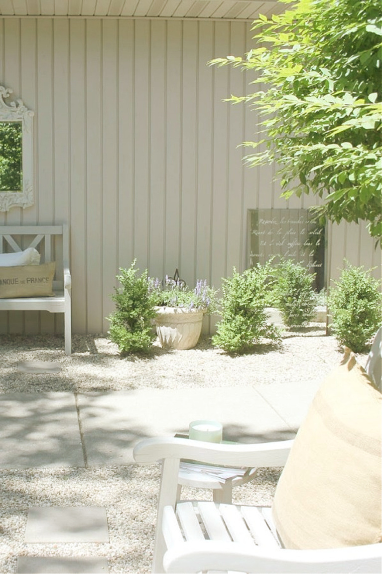 French script stenciled mirror in my French country courtyard - Hello Lovely Studio.