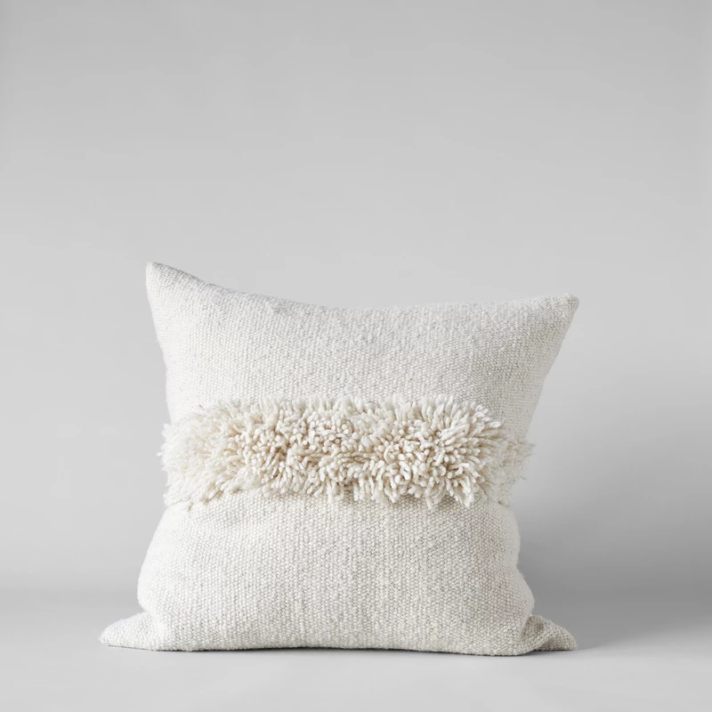 Puna Handwoven ivory pillow and 25 Beautifully Handmade Decor Finds for Home to help you feather your nest and also inspire your interior design schemes.