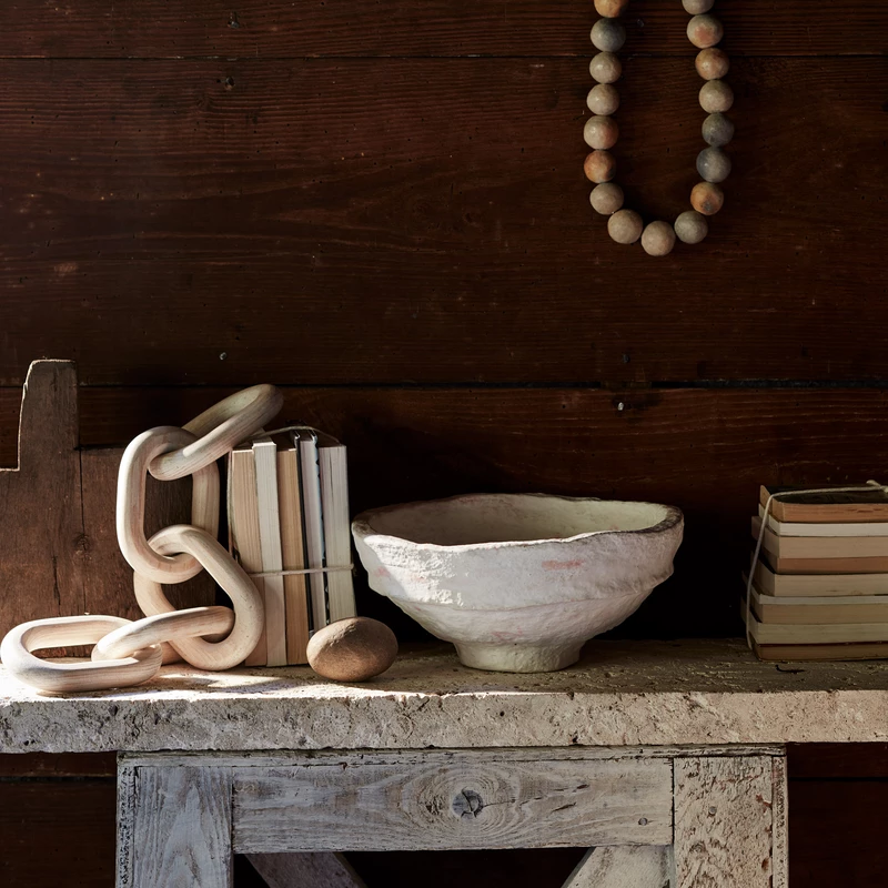 Rustic vignette with handmade paper mache bowl and clay beds from Bloomist.