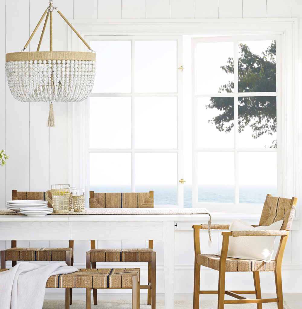 Beach house dining room with Malibu chandelier over white table - Serena & Lily. #beachhouse #diningrooms #chandelier