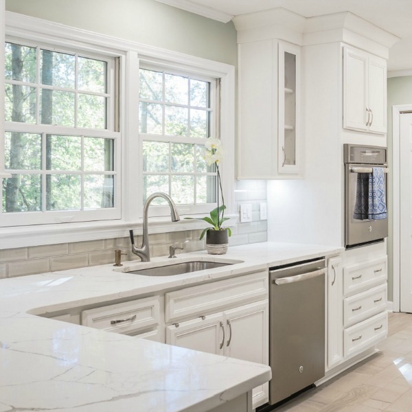 Beautiful kitchen design with white cabinets and stainless appliances by Marsh Kitchens on Hello Lovely.