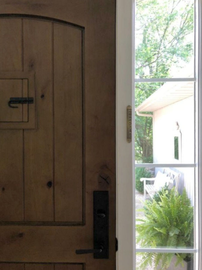 Walnut stained alder front door with speakeasy - Hello Lovely Studio.