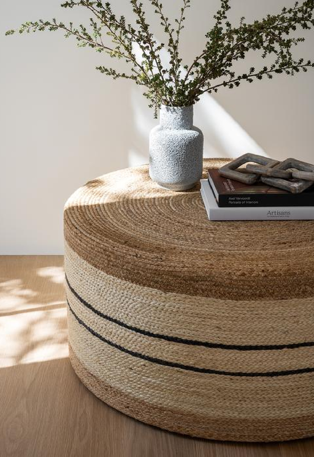 Round woven ottoman (Brynlee) by McGee & Co. makes a perfect rustic, neutral decor statement in a variety of interiors.