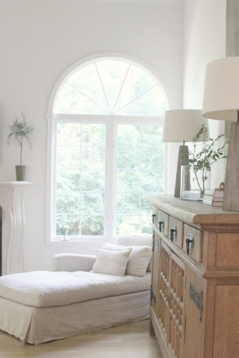 Belgian linen chaise and antique sideboard from Belgian in our European farmhouse inspired living room - Hello Lovely Studio. #hellolovelystudio #livingroom #europeancountry #belgianlinen #interiordesign