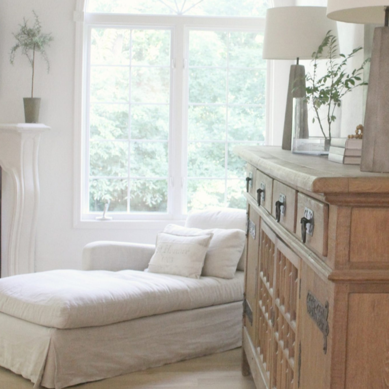 Belgian linen chaise and antique sideboard from Belgian in our European farmhouse inspired living room - Hello Lovely Studio. #hellolovelystudio #livingroom #europeancountry #belgianlinen #interiordesign