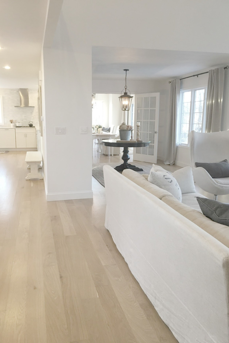 Open floor plan in our European inspired country cottage home with white oak hardwood flooring and Belgian inspired furniture. #hellolovelystudio #livingroom #europeancountry #interiordesign #belgianlinen #whiteoak #hardwoodfloors