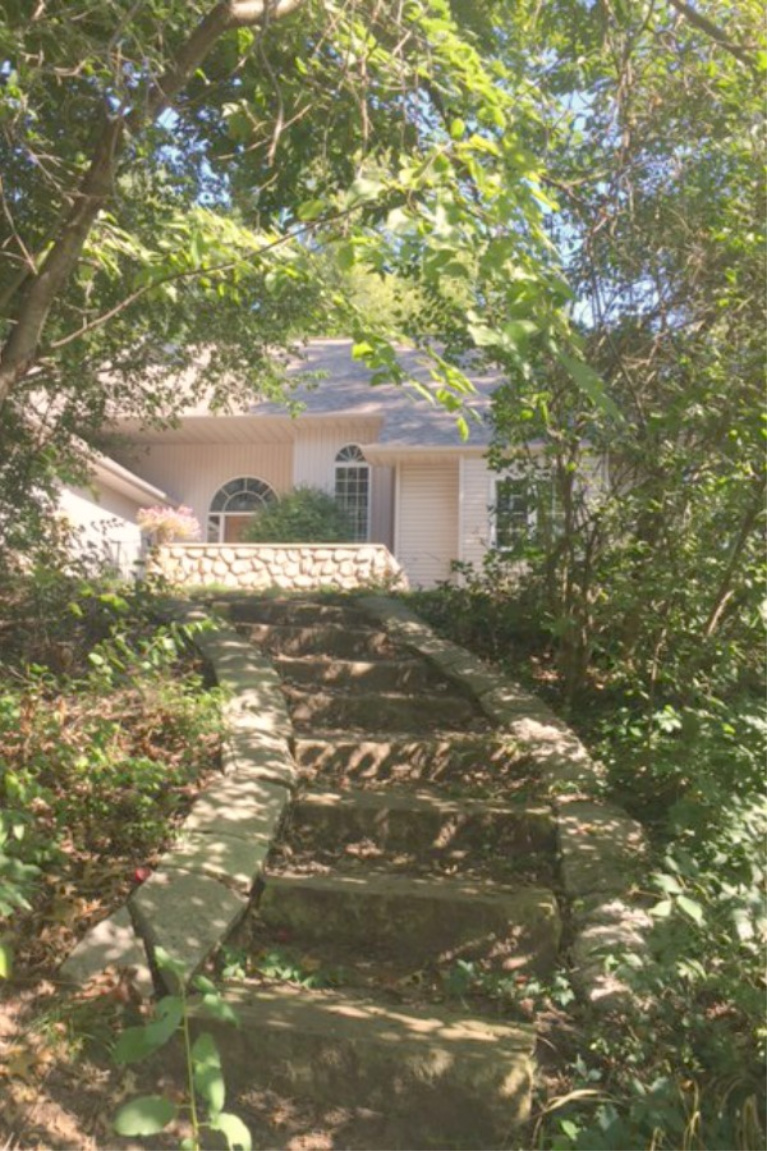 Wodsy exterior of our charming cottage sited on a hill with a front stone walled courtyard. #hellolovelystudio #cottageexterior #cozycottage