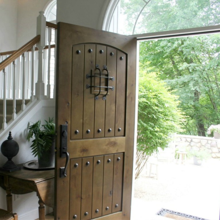 Knotty alder front door with speakeasy in our European country inspired cottage. #hellolovelystudio #knottyalder #frontdoors #exteirordoors #europeancountry #frenchcountry #entry