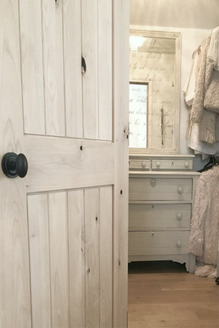 Knotty alder interior door with bronze hardware opening to my closet with Victorian painted dresser. #hellolovelystudio #knottyalder #interiordoors #rusticdecor #frenchcountry #interiordesign